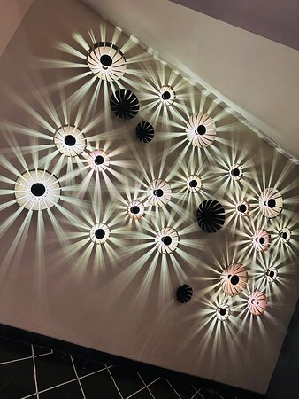 Artistic Sunburst Disc Decorative Wall Sconce