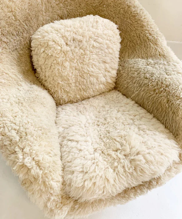 Acogedor sofá sillón de piel de oveja de lana