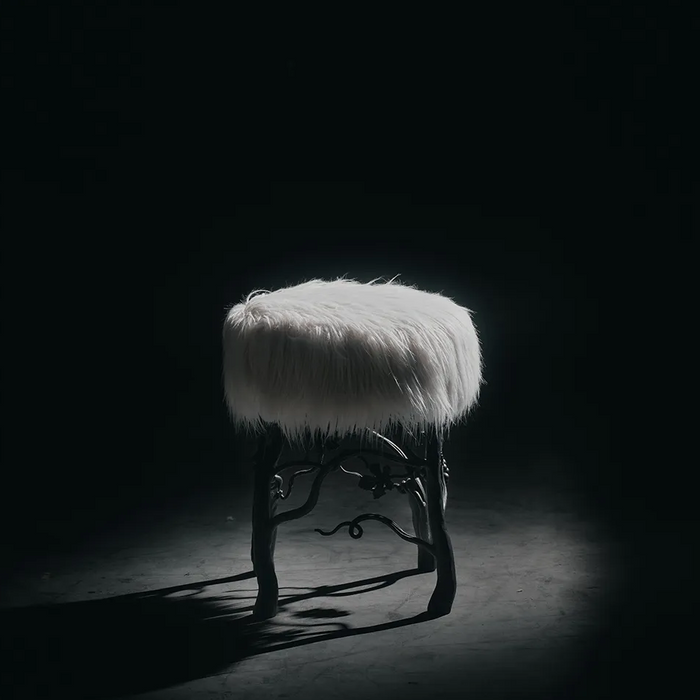 LYFAIRS x GORDON GU Bodega Pouf with white fur and black grapevine leg