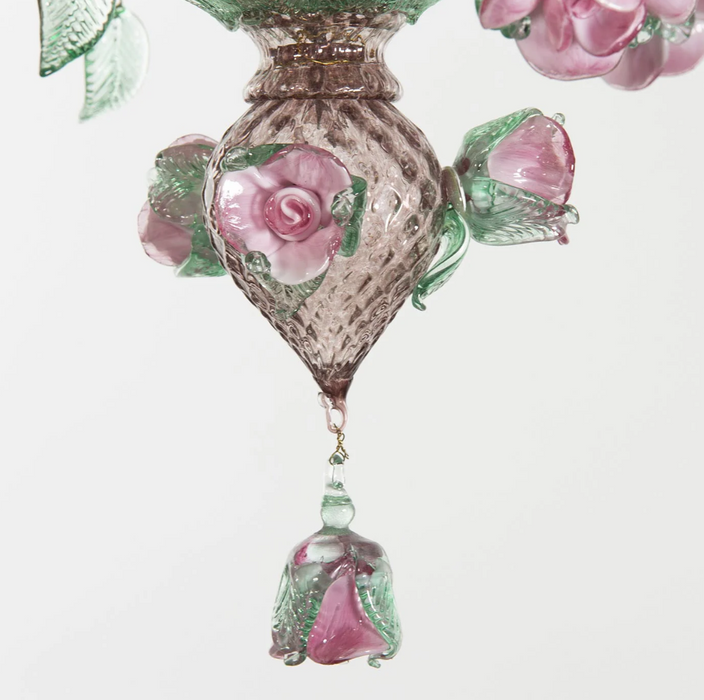 The detail of a pink rose glass chandelier 