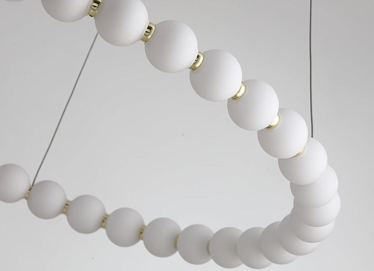 Araña de bucle de anillo de perlas acrílicas creativa moderna