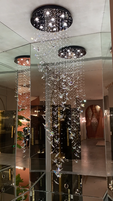 Lampadario a farfalla galleggiante in cristallo K9 in stile nord europeo per scala foyer/plafoniera a spirale per sala da pranzo d'ingresso