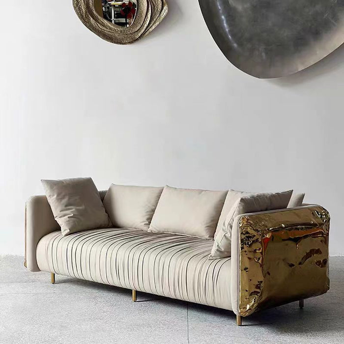Sofá gris claro creativo de lujo con acabado en latón
