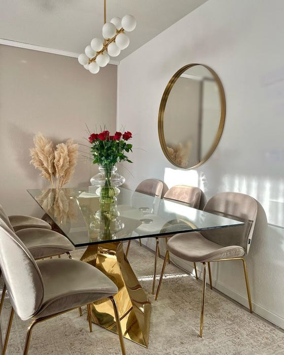 Mesa de comedor de vidrio con patas doradas de lujo