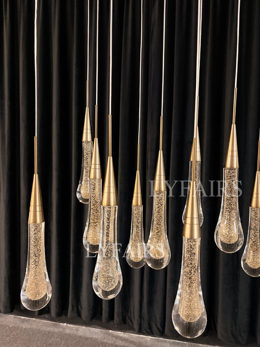Lampadario moderno in cristallo lineare a cascata con goccia di pioggia per sala da pranzo/isola cucina