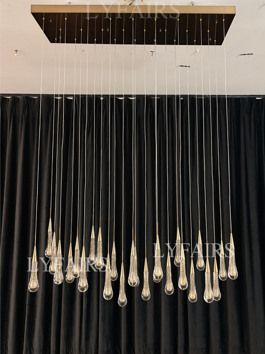 Lampadario moderno in cristallo lineare a cascata con goccia di pioggia per sala da pranzo/isola cucina
