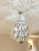 spiral, acrylic, tiered,living room, dining room, shining , upmarket, post-modern, spiral waterfall, chrome, gold,